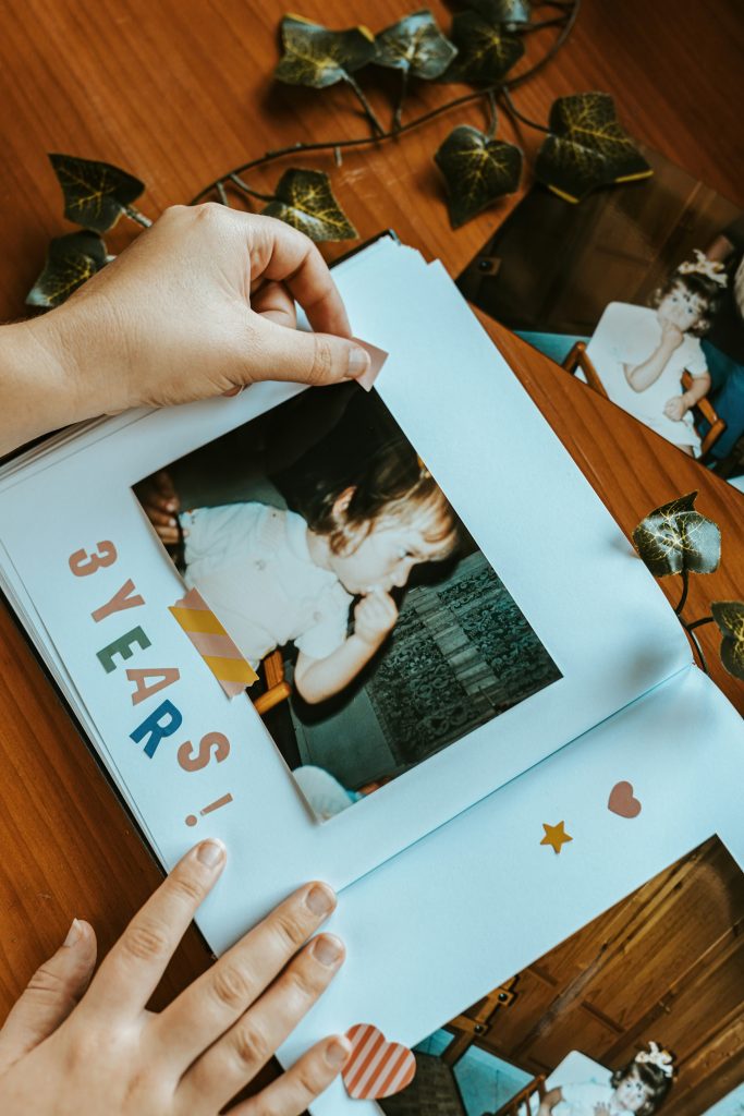 This is a scrapbook with a picture of a three year old boy.